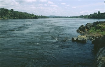 UGANDA, Jinga River, View down river bridge in distance Source of the Nile