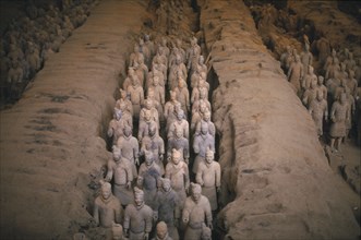 CHINA, Shaanxi, Xian, Terracotta warriors in rows in pits at original excavation.