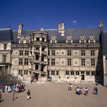 FRANCE, Loire Valley, Loir et Cher, Blois Chateau. Tourists at entrance with circular external
