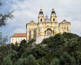 AUSTRIA, Lowe Austria, Melk, Melk Abbey with twin clocktowers on a hilltop surrounded by trees