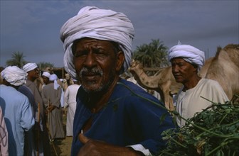 EGYPT, Upper Egypt, Daraw, Portrait of Egytpian man in camel market