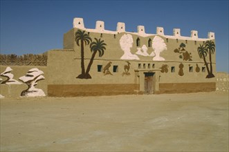 EGYPT, Western Desert, Farafra Oasis, General view of museum building. Mural on facade painted by