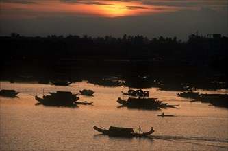VIETNAM, Hue, Boats on the Perfume River at sunset.