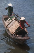VIETNAM, Cai Lay, Sampan rowed by two standing oarsmen.