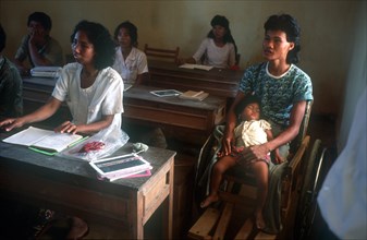 CAMBODIA, Education, Adult literacy class.  Students including mother with child.