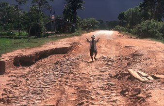 CAMBODIA, , Young boy on National Route 5 from Pursat to Moung Roessei.
