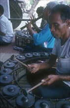 CAMBODIA, Phnom Pehn, Group of musicians playing traditional instruments.