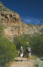ARGENTINA, Mendoza Province, Valle Grande, Canyon trekkers on path near San Rafael.