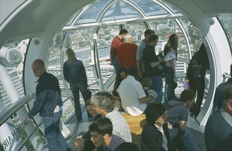 ENGLAND, London, British Airways London Eye Milennium wheel interior of capsule with tourists