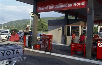 WEST INDIES, Jamaica, Montego Bay, Star Of The Jamaican Road petrol station with attendant filling