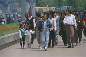 CHINA, Shaanxi, Shanghai, Chinese tourists walking along the Bund