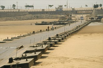 CHINA, Shandong, Jinan, Floating pontoon bridge crossing dry bed of the Yellow River after water