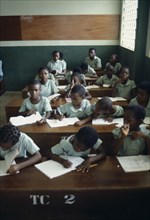 NIGERIA, Rivers State, Children at desks in a classroom