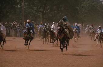 NIGERIA, Katsina, Racing horsemen salute the Emir at the start of the Durbah Salah