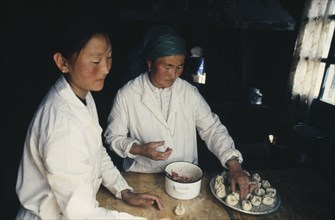MONGOLIA, People, Making Buuz steamed minced lamb dumplings.