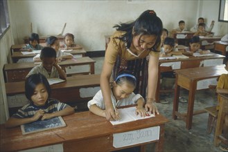 LAOS, Education, Teacher and infants in UNHCR school for Hmong returnees