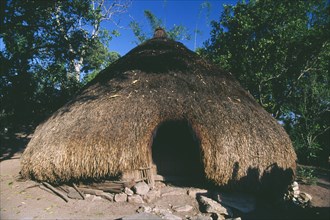 INDONESIA, Timor, Kefemenanu, Traditional conical home with straw roof