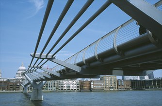 ENGLAND, London, View along the underside of the Millennium footbridge over the River Thames