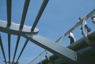 ENGLAND, London, Section of the underside of the Millennium footbridge with pedestrians looking