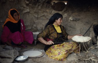 EGYPT, Western Desert, Settled Bedouin women making bread