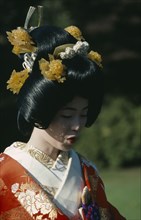 JAPAN, Honshu, Tokyo, Shinto wedding with bride in traditional dress and elaborate hairstyle
