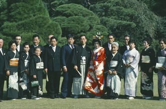 JAPAN, Honshu, Tokyo, Formal portrait of Shinto wedding group.