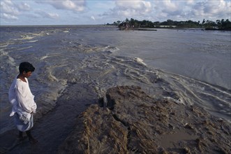 BANGLADESH, Bhola, Water gushing in and out of breach in main coastal embankment