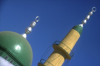 EGYPT, Nile Valley, Aswan, Elephantine Island. Minaret and dome of small mosque painted green and