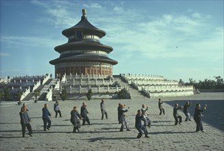 CHINA, Hebei, Beijing, Men doing Tai Chi in front of the Hall of Prayer for Good Harvests at the