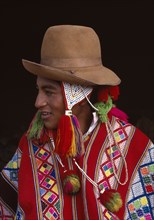 PERU, Cusco, Vilcanota, Portrait of boy from Tinqui wearing typical hat and poncho.