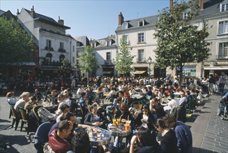 FRANCE, Loire Valley, Indre et loire, Tours Place Plumereau with view over people eating at tables