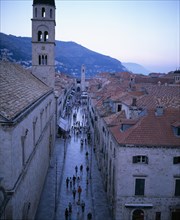 CROATIA, Dalmatia, Dubrovnik, Aerial view along Placa from Pile Gate toward Ploce at dusk