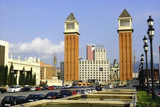 SPAIN, Catalonia, Barcelona, Placa d Espanya. View of the two 154ft high brick campaniles by Ramon