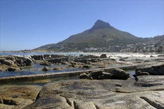 SOUTH AFRICA, Western Cape, Cape Town, Caps Bay. View over rocky coastal area with beach and