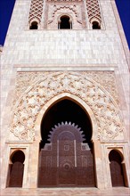 MOROCCO, Casablanca, Hassan II Mosque massive stone arch doorway in tower