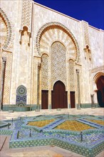 MOROCCO, Casablanca, Hassan II Mosque courtyard with mosaic star shaped brickwork fountain and