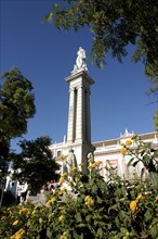SPAIN, Andalucia, Seville, Plaza del Triunfo with statue a top of tall column