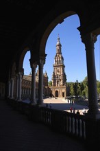 SPAIN, Andalucia, Seville, Plaza de Espana. View toward end tower from archway