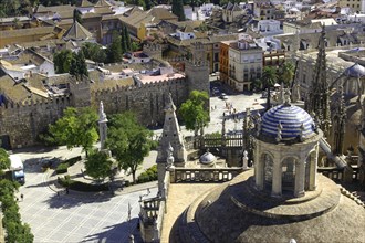 SPAIN, Andalucia, Seville, Seville skyline seen over blue striped roof dome