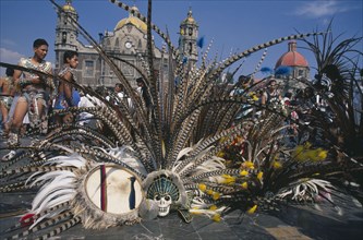 MEXICO, Mexico City, Our Lady of Guadaloupe Festival dancers outside the Basilica with feather head