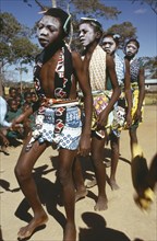 TANZANIA, Festivals, Makonde girls wearing ritual face whitening and dancing during female