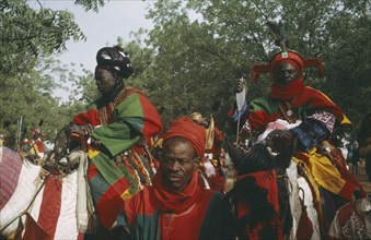 NIGERIA, North, Katsina, "Salah Day.  The Emirs entourage, mounted men in brightly coloured costume