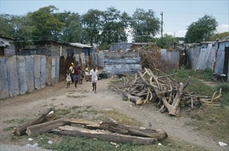 WEST INDIES, Jamaica, Kingston, Bower Bank Transit Camp.  Children in poor housing area.