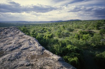 TANZANIA, Serengeti, View over classic Acacia Thorn country from a Kopje a smooth sandstone outcrop