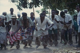 TANZANIA, Dodoma, Ngomas dancers using clusters of nuts tied around their ankles as instruments