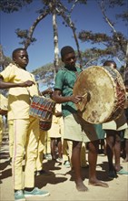 TANZANIA, Makonde, Young musicians playing drums