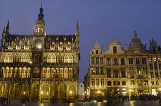 BELGIUM, Brabant, Brussels, The Grand Place illuminated at night busy with people.