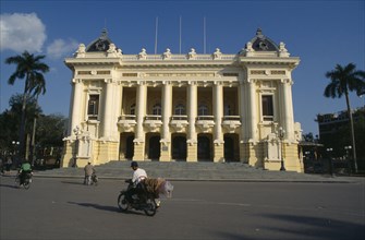 VIETNAM, North, Hanoi, The Opera House.  Exterior facade with passing cyclist and moped.