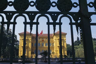 VIETNAM, North, Hanoi, The Presidential Palace yellow painted exterior facade seen through metal