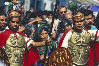 GUATEMALA, Antigua, Mayan Indian women and men dressed as roman soldiers at the famous Easter